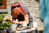 Participant on wood-carving workshopat Denmark Farm Conservation Centre, Lampeter, Wales, UK. June 2011. Model released