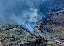 Aerial view of solidified lava and steam from the  Erta ale volcano (the smoking mountain) in the Afar desert, Northern Ethiopia, February 2009