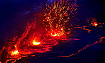 Eruption and molten lava flowing down the sides of the Erta ale volcano (the smoking mountain) in the Afar desert, Northern Ethiopia, February 2009
