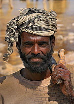 Man working in salt extraction from Karoum salt lake, Danakil depression, northern Ethiopia, February 2009