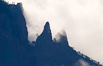 Mountain ridges of Caldera de Taburiente silhouetted through clouds. View from Roque de los Muchachos, La Palma Island, Canary Islands, Spain, February.