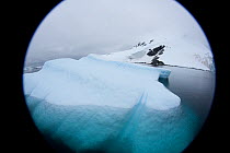 Iceberg viewed through camera lens, off the Antarctic peninsula, Antarctica, January 2009, taken on location for BBC Frozen Planet series