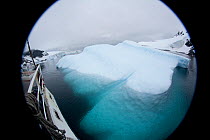 Iceberg viewed through camera lens from the 'Golden Fleece' ship, off the Antarctic peninsula, Antarctica, January 2009, taken on location for BBC Frozen Planet series