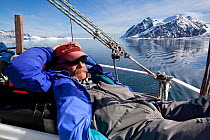 Dr Robert (Bob) Pitman, from US National Marine Fisheries Service, scientific advisor, relaxing on board The Golden Fleece prior to searching for whales, Antarctic Peninsula, Antarctica, January 2009,...