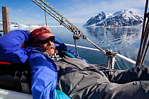 Dr Robert (Bob) Pitman, from US National Marine Fisheries Service, scientific advisor, relaxing on board the 'Golden Fleece' prior to searching for whales, Antarctic Peninsula, Antarctica, January 200...