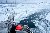 Broken ice in the wake of the 'Golden Fleece' (base ship of the BBC film crew) off the Antarctic Peninsula, Antarctica, January 2009, Taken on location for BBC Frozen Planet series