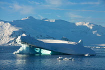 Iceberg showing wave erosion off the Antarctic peninsula, Antarctica, January 2009, Taken on location for BBC Frozen Planet series