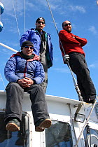 Wildlife cameraman Doug Allan alongside Dr John Durban and Dr Robert (Bob) Pitman, scientific advisors on series, Antarctica.  Taken on location for BBC Frozen Planet series, January 2009