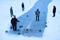 A bonspiel, traditional curling tournament held on frozen loch, Leightonhill Lake, Brechin, Angus, Scotland, UK, January 2010
