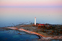 Lighthouse and buildings at the end of peninsula. Hiiumaa Island, Estonia, Europe, April.