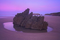Rock Formation and Rock Pool at Dawn Marloes Sands Pembrokeshire Wales, at low tide