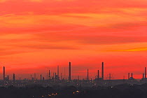 Sunset over Fawley oil refinery viewed from Portsdown Hill, Hampshire, UK, October 2010