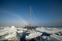 Photographers travel via a steel hull sailboat to circumnavigate the Svalbard Archipelago in summertime, Norway, July 2011