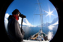 Johm Durban, scientist, on board the 'Golden Fleece', base ship for the BBC film crew looking out for whales, Antarctica, February 2009, Taken on location for BBC Frozen Planet series
