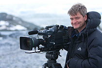 Wildlife Cameraman, John Aitchison, on location, Antarctica.  Taken on location for BBC Frozen Planet, February 2009