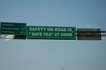 Amusing road safety sign above road on road to Hyderabab, capital of Andhra Pradesh, India