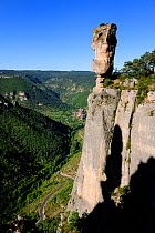 Eroded rocks at summit of Gorge de la Jonte with Peyreleau village in the background. Tarn, Cause, Cavennes, France.