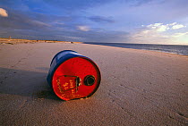 Metal can dumped and washed up on beach, Sado estuary, Portugal