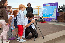 Children being educated about seabirds at Scottish Seabird Centre, North Berwick, Firth of Forth, Lothian, Scotland, UK, August 2011