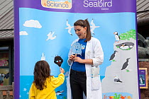 Children being educated about seabirds at Scottish Seabird Centre, North Berwick, Firth of Forth, Lothian, Scotland, UK, August 2011