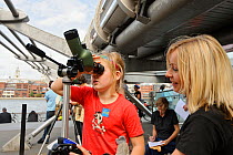 Casey Dean with RSPB staff member Emma Cambell attending the RSPB 'Date With Nature Event' for learning about urban Peregrine falcon, Tate Modern, South Bank, London, UK, September 2011, RSPB Greater...