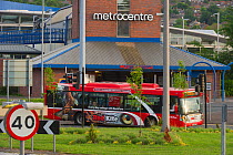 Red Kite bus passing the Metrocentre in the Urban Red Kite area of the Derwent Valley, Gateshead, Tyne and Wear, UK, on the edge of Tyneside following on from the 'Northern Kites' re-introduction prog...