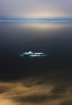 Iceberg in calm arctic seas at 80 degrees north. Svalbard, September.