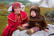 Kristina Neyva, a Khanty woman, with her son Kleb at a reindeer herders' camp in the Polar Ural Mountains. Yamal, Western Siberia, Russia.