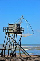 Traditional carrelet fishing hut with lift net on the beach at Saint-Michel-Chef-Chef, Loire-Atlantique, France September 2011