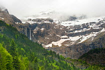 Gavarnie Falls, cascade down through the clouds from near the top of the mountain, Pyrenees, France, June. 2011.