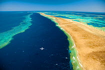 Whitsunday Islands, aerial view with hydroplane landing, Great Barrier Coral Reef, Queensland, Australia, October 2011.