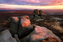 The Barrow Stones at sunset, an outcrop of gritstone, Peak District National Park, Derbyshire, UK, January.