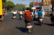 Motorbikes on busy main road in Nagpur, Maharashtra, India, 2005