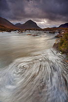 Swirling foam patterns in the River Sligachan, with Marsco in background, Isle of Skye, Inner Hebrides, Scotland, UK, October 2010