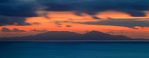 Panoramic view over sea towards Rum from Neist Point, at dusk, Isle of Skye, Inner Hebrides, Scotland, UK, October 2010