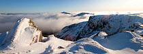View from the summit of Braeriach with temperature inversion clouds and the summits of Sgòr an Lochain Uainewith (The Angel's Peak) and Bod an Deamhain (The Devil's Point) beyond, Cairngorms NP, Scot...