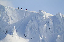 Cimbers on the north face of Coire an t-Sneachda in the Northern Corries in winter, Cairngorms NP, Scotland, UK, March 2010. 2020VISION Exhibition. Did you know? The name of this popular climbing and...