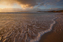 Low waves washing on sandy shore, Horgabost, Isle of Harris, Outer Hebrides, Scotland, UK, October 2011