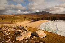 View of Traigh Mangerstadh from a clifftop overlooking the bay, with rocks in the foreground, Isle of Lewis, Outer Hebrides, Scotland, UK, October 2010