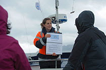 Sea Life Surveys guide briefing tourists on seabird identification, Sound of Mull, Inner Hebrides, Scotland, UK, July 2011
