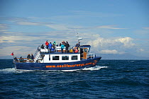 Sea Life Surveys vessel Sula Beag with tourists, near the Isle of Rum, Inner Hebrides, Scotland, UK, July 2011
