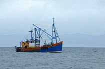 Scallop dredger Dawn Maid TN102 fishing near the Isle of Coll, Inner Hebrides, Scotland, UK, July 2011