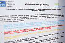 Close-up of sign detailing the wildlife watching code used by boat operators watching White-tailed sea eagles on Skye, Inner Hebrides, Scotland, UK, June 2011