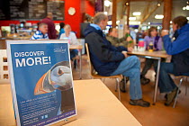 Tourists sitting in cafe at Scottish Seabird Centre, showing economic benefits of presence of Bass Rock, North Berwick, Scotland, UK, August 2011. 2020VISION Book Plate.