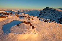 Exposed rock and snow deposits on Ben More Coigach in winter, Coigach, Wester Ross, Scotland, December 2010