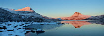 Panoramic of Sgurr Tuath and Stac Pollaidh at dawn, with partly frozen Loch Lurgainn in foreground, Coigach, Wester Ross, Scotland, UK, December 2010