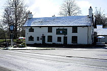 The White Swan public house in snow, Swan Green, Lyndhurst, New Forest National Park, Hampshire, April 2008