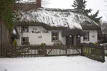 The Royal Oak public house in snow, North Gorley, New Forest National Park, Hampshire, UK, February 2009