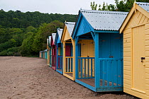 Coloured beach huts at Llanbedrog, Gwynedd, Wales, UK, May