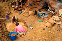 Man and woman gold mining near Daraine, a threat to the natural habitat of the Tattersalli / Golden crowned sifaka (Propithecus tattersalli) Madagascar, November 2010
